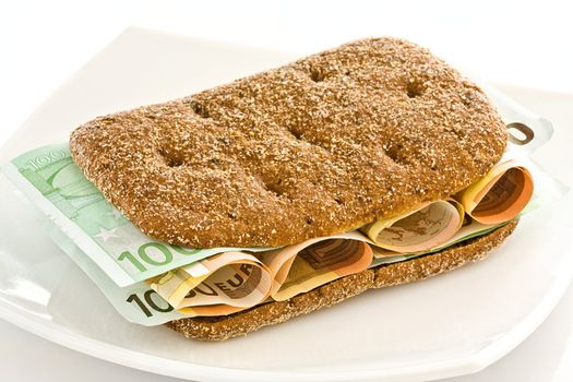 Fresh bread with a layer of monetary denominations inside
