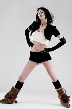 Young brunette in extreme high fashion pose