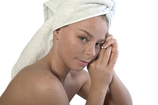 Studio portrait of a spa girl with a towel around her head