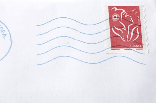 A white envelope letter with stamp