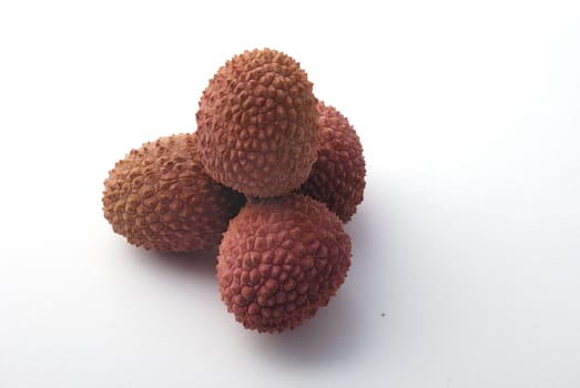 litchis on a white background