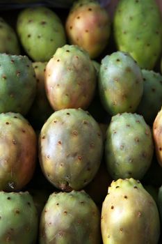 Ripe fresh pickly pears in crate on market