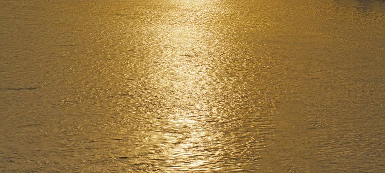 Close up of water of river at the sunset