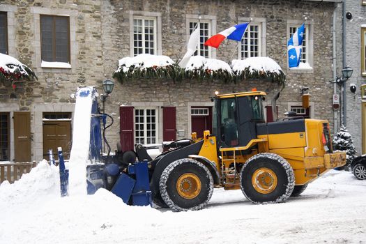 Snow removal vehicle removing snow after blizzard in Quebec City, Canada.