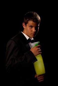 Teenager impersonating 007 holding a cleaning spray