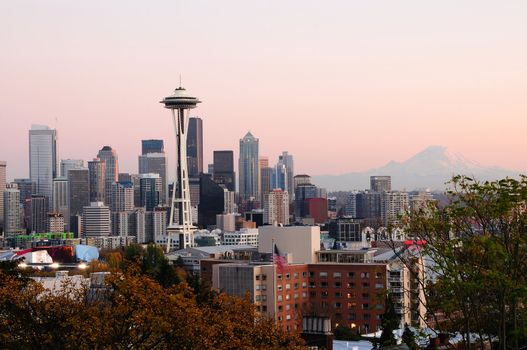 Beautiful city of Seattle glowing at dusk with Mount Rainier in the backdrop