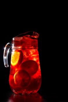 Jug of chilled Spanish sangria with fresh fruit