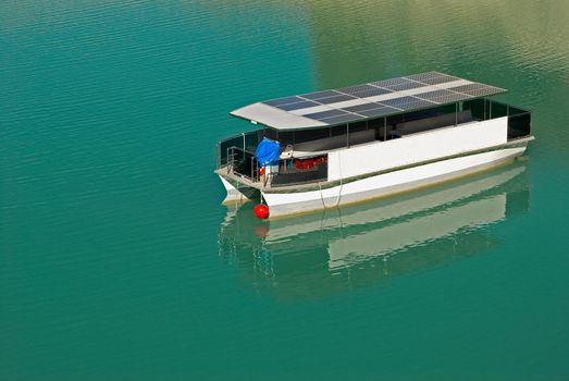 New technology solar boat in calm lake waters