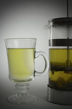 Green tea brewing in pot