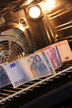 Many banknotes are baking in the stove