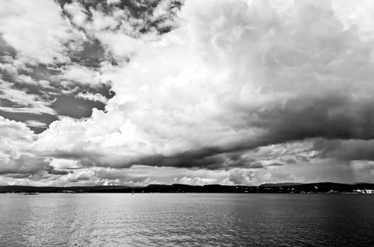 dramatic cloudscape in the harbor of Oslo Norway