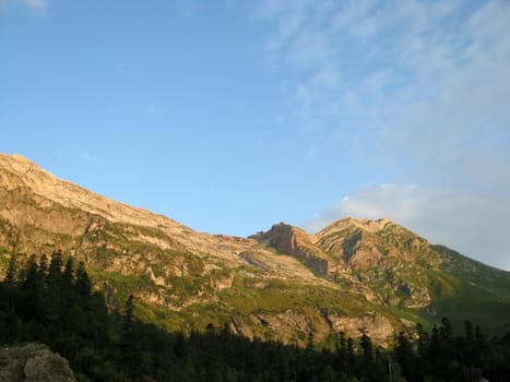 Mountains, rocks; a relief; a landscape; a hill; a panorama; Caucasus; top; a slope; a snow, a cool