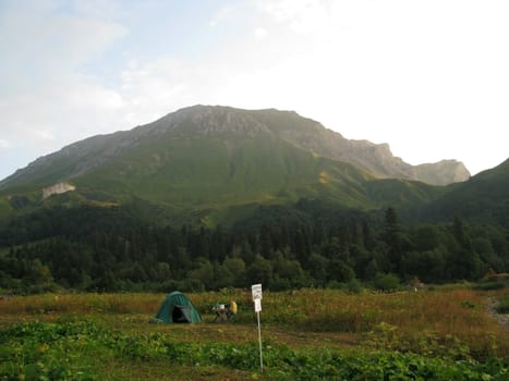 Mountains, rocks; a relief; a landscape; a hill; a panorama; Caucasus; top; a slope; a snow, a cool, clouds