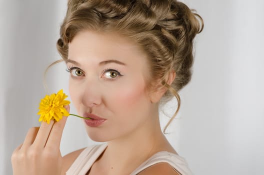 beauty woman closeup portrait with flower over grey background