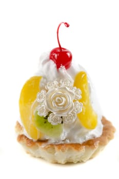 cupcake and bijouterie flower on a white background