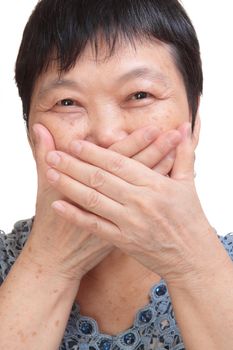 old woman covering her mouth