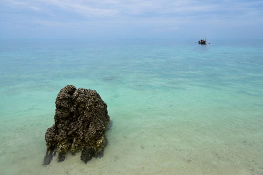 Single boat in endless blue sea