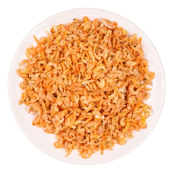 Heap of dried shrimps on a white plate