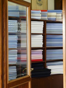 Fabrics on the shelves in a tailor store