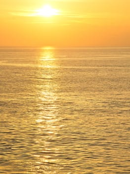 Beautiful reflection in water of orange sun 