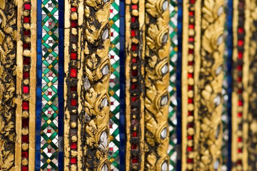 Pattern of mirror mosaic on the wall in Grand palace, Bangkok, Thailand