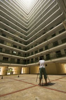 man take photo of Hong Kong public housing apartment block 
