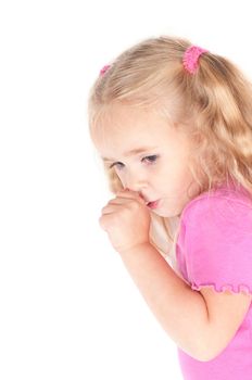 Little cute girl in pink and with ponytails in studio