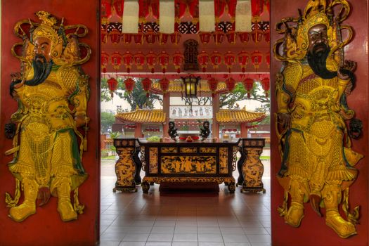 Chinese Temple Red Wooden Doors leading to outdoor altar table