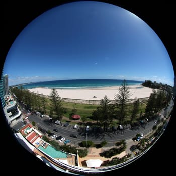 Fish eye view on the beach from a skyscraper balkony