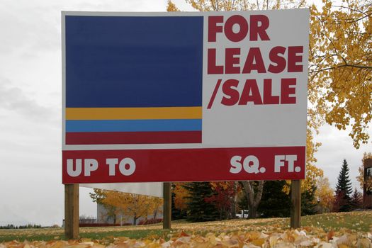 For lease or for sale sign on the field