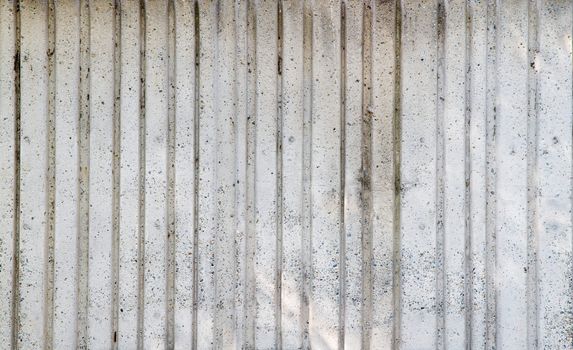 Gray Deep wide vertical grooved concrete wall