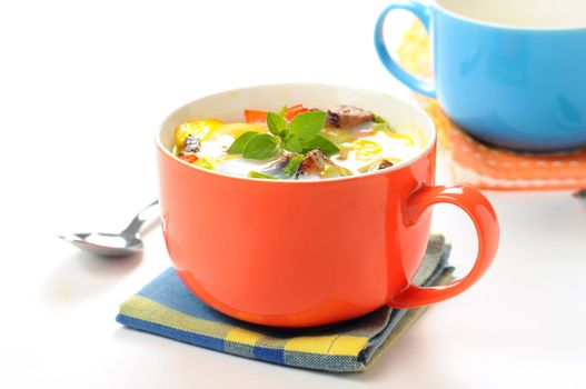 Baked egg, steak and vegetables in a cup.