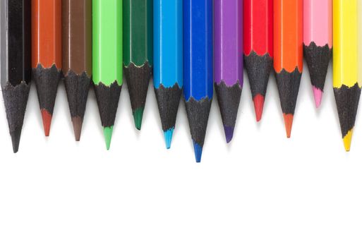 Colored pencils isolated over white background