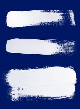 Texture of white brush strokes on blue background.