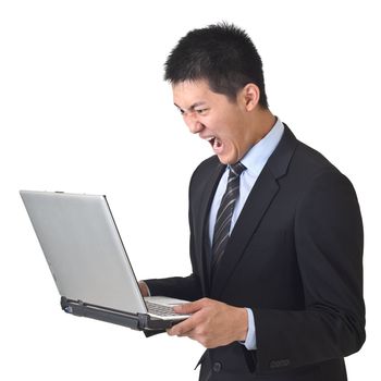 Angry business man holding laptop on white background.