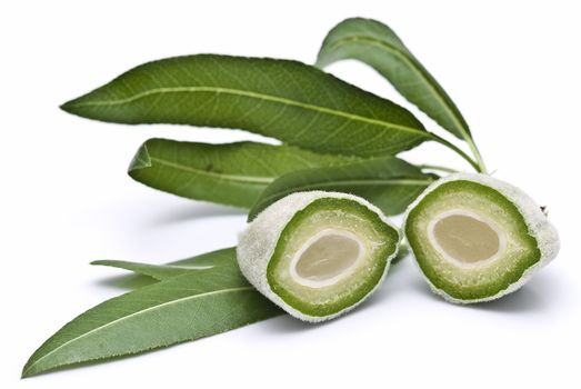 Green almonds isolated on a white background.