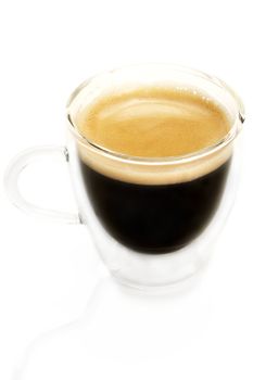 espresso coffee in a glass cup from slightly top on white background