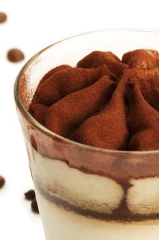 tiramisu soft focus closeup on white background with coffee beans