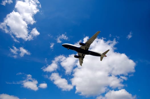 Blue and cloudy sky and airliner