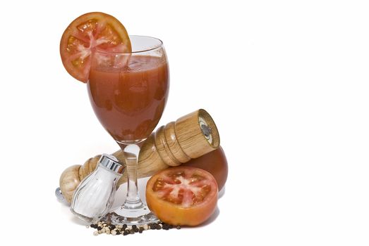 A cup of tomato juice on a white background.