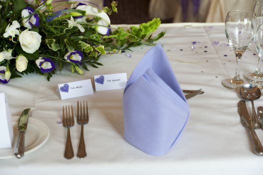 table setting at wedding breakfast with bride and groom tags