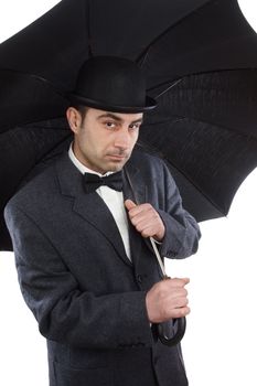 man with bowler hat and an umbrella 