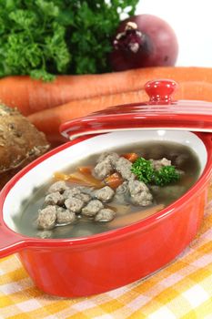 Liver noodles soup with vegetables and parsley in a soup tureen