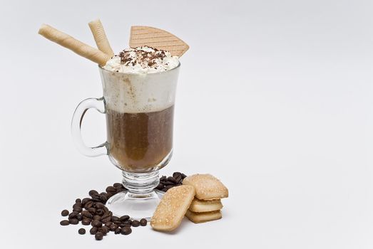 A cup of coffee with whipped cream on a white background.