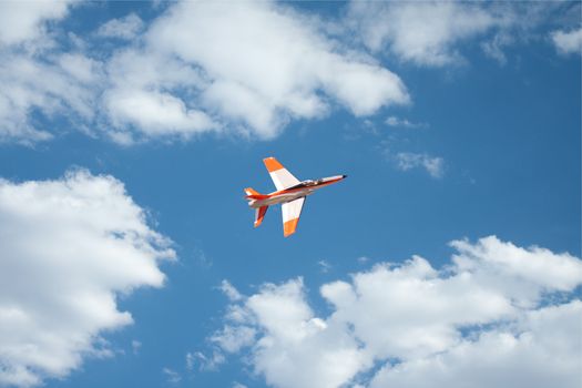 RC remote controlled Real Jet airplane model in action on blue sky