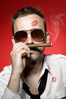 young handsome man with cigar and lips imprints