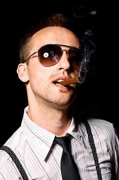 young businessman smoking cigar