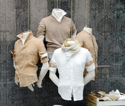 various fashionable men's shirt in shop window