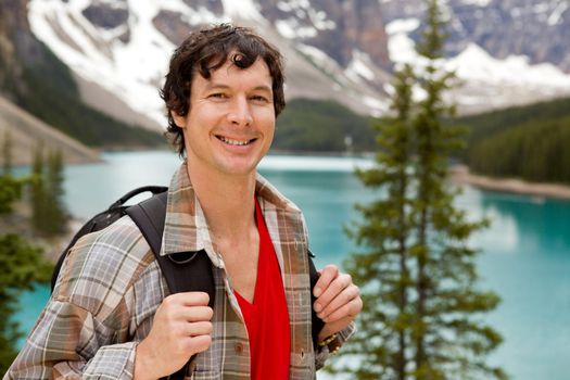 A portrait of a smiling young male at Lake Moraine, Alberta, Canada