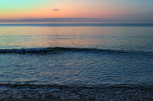Sea surface with small soft waves in morning